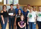 Pictured in the photo: Members of the Carriere family: Jeanne Halle, Tracy Hamm, Second Chance for Life President Tracie Vandenburgh, Bob Carriere, Sue Carriere, David Mugaas, Jeannette Carriere, Mary Jo Mugaas, Nancy Carriere, McKenzie Hamm and Malayna Hamm.
