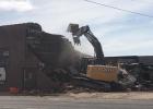 Down it goes... The Bagley Mercantile and Dave’s Stereo Shop went down  after over 120 years of serving customers in the area.