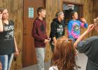 (Left to Right) - 4-H Ambassadors, Kendra Rondorf, Nick Solie, Tanisha Srnsky, and Sidney Olson lead the group in a couple 4-H songs at 4-H Get Green Night.
