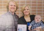 Amie (Salvhus) Erickson with her husband David and their son, Josiah who was recently honored at Northland Community Technical College.