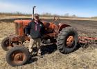 Bryan "Bud" Bjerklie standing by one of the WD Allis Tractors.