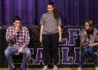 (left to right) Chris Shulstad and Akayla Rondorf participated for their team of who could eat the 4-H Candy Bar the fastest.  Paige Olson, 4-H Ambassador, was judging the first one to complete the task.