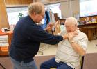 No Jerry Wraa is not choking Lloyd Engen at the Clearbrook-Leonard Senior Center. He is showing him some defensive techniques. They were also shown some easy ways to get out of a chair with less effort. Many were able to view the different demonstrations at the site.