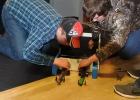 Two ninth graders, Tyler Hanson and Garrett Qualley, setting up to race C02 cars. 