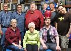Mike Swenson and family celebrated his retirement after a long, successful teaching career. Family members with him included: (Seated) Kaylynn Wold, his mother Joyce, and Andy. (Standing) Tom Wold, Paul, Mike, Adam holding Aubrey, and Landon.