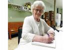 With pen and paper in hand, Darlene Sawyer keeps writing, first while a teacher, and now as a journalist. 