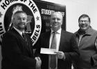 Garden Valley CEO/General Manager Tim Brinkman and Garden Valley Director Jerry Freitag are shown presenting a $5,000 Education Foundation technology grant, for the RLCC Public School, to RLCC/RLF School Superintendent Jim Guetter (left).