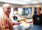 Debbie Lewis Chief Deputy Auditor/Treasurer of Clearwater County hands Matt his receipt. He is now officially running.
