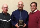 Randy Huie accepting his plaque for Minnesota Class A State High School Assistant Coach of the Year in Boys Basketball. He is pictured with his brother Frank (right) and Head Coach Steve Philion (left).