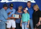 The Thorbeck-Imle family being presented with the Century Farm award at the Clearwater County Fair. The Imle family from left to right: Paul, Kathy, Sarah, Peter and Tracy.