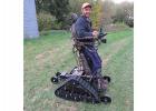 Brian Engebretson of Clearbrook demonstrates how easy it is to get around with the ActionTracker. He was recently surprised with the presentation that he received so that he would be able to stand upright and go hunting this year. Brian stated that, “it is a whole new world that he sees.”  Darien Northup, Operations Executive Director from Clear Waters Life Center in Clearbrook and Tim Sharp spearheaded the campaign to purchase the ActionTracker for Brian.