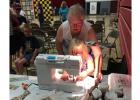 Shirley Dessellier helping Nicolina Hofstad with her Make n' Take project at Oklee Market Day on August 13th.