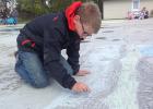 Pumpkin Day CHALK IT UP contestant Tallon Vorderbruggen working hard on his creation which included the Great Wall of China, the New York City skyline, Eiffel Tower and more.  His work paid off, he walked off with 1st place in his age group and $20 cash!
