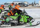 Damen Bakke runs his sled out of the fuel stop, you must walk/run beside the sled while in the fuel stop for safety reasons. Photo credit Mandi Bakke.