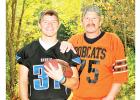 Matt Vettleson wearing his Rebels football jersey with his dad Alan wearing his Bobcat Jersey.