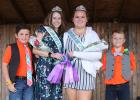 The 4-H Fashion Revue was part of the Clearwater County Fair. Champions in Grades 9 and up were Tessa Tramm with the Constructed Clothing, the long dress and MacKenzie Dahl in the short outfit with the Purchased Clothing class. Helpers for the evening were Hayden Hood on the left and Micah Tramm on the right.