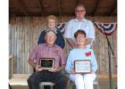 James “Jim” Cairns and  Crystal Schmitz were honored at the Clearwater County Fair last Saturday morning. They were named the County Outstanding Citizens this year. Standing are the Committee Co-chairpersons Dee Strandlien and Al Paulson.