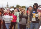 Kaylin Erickson of Clearbrook watching as her pumpkin was weighed. She had the record for the day and for the past 25 years. Her pumpkin weighed in at 1,348 pounds. She is the one with sun glasses in the middle. 