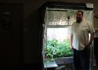 Dan Swanson stands next to one of the hydroponic garden areas in his store located in Bagley, “Extended Seasons”. 
