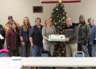 The out going and in coming mayors for the City of Gonvick were treated to a cake at the monthly meeting. From left to right: Devin Aakre, Ken Thomas, Lila Coulter, Stacy Halvorson, Sue Sims, Candace Coulter, Lauris Krogstad, Jason Bakke, Corrine Richards and Eileen Lien.  