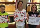 4th Grade Poppy Poster winners at the Clearbrook-Gonvick Elementary School were from right to left:  1st - “Remember Them” - Mysten Dalhke, 2nd - Seneca Johnson and 3rd - Blayten Benson.
