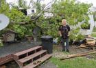 Denise Hanson from Clearbrook with her turned over summer home at Pine Lake. Many things were left untouched but the trailer was on his side and so much other damage. 