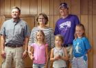 Del, Cindy Determan and their son Jess, with his children Emma and Elizabeth and Macy, daughter of Brad Determan accepted the Farm Family Award July 24.
