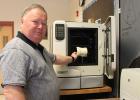 Shown with the equipment is Clearbrook-Gonvick Superintendnet Wayne Olson.