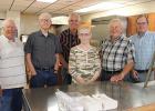 The beans, BBQ macaroni salad and visiting were free at the Clearbrook-Leonard Senior Center during Clearbrook Summer Fest Day activities. From left to right: Lloyd Engen, Lowell Stevens, Jim Shelquist, Margaret Stevens, Duane Johnson and Jim Chesley were there to serve the goodies.