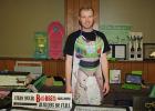 Corey Olson, formerly from Oklee, comes back every year to Oklee Market Day with his creative signs. 