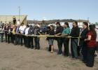 Red  Lake Tribal Chairman Darrell Seki about to cut the ribbon at the opening ceremony at the Red Lake Nation College and the Government Center buildings in Red Lake. To his right Red Lake District Rep. Roman “Ducker” Stately and on his left Tribal Treasurer Annette Johnson. 