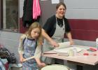 Lefse Fest was held in Fosston last Friday evening and participant Kristin Erickson was busy rolling out lefse while her daughter was keeping a close eye on the griddle. Kristin was the 2016 lefse making champ during last year's Lefse Fest.