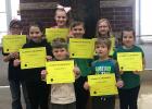 March Elementary Students of the Month Pictured in front:  Brody Gustafson, Adam Bunker, Pictured in middle: Erika Rude, Erik Preuss, Becca Dahl, Pictured in back: Bryce Helberg, Serenity Daken and Hailey Sundquist.
 