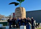 
Sen. Mark Johnson (second from left), Capital Investment Committee members, and local leaders hold up one finger for Senate District 1 in front of the world’s largest sugar beet statue in Halstad, Minn., during a northwest Minnesota infrastructure tour