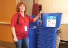 “We are hoping this will do some good,” said custodian Marlene Gerbracht who  began placing the recycle bins in the classrooms. “Head Start is very excited about this also, as they are already recycling.” One class of youngsters was very surprised when the huge compactor was placed directly in front of their window. The students thought it looked like part of a train.