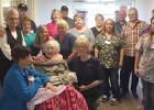 Enice Nordlund was the first resident to leave the Good Samaritan Center in Clearbrook after the meeting that was held to close the facility. She will be 104 on November 29. Shown with her are family and staff from the center wishing her well.