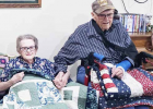 Rosie and Norman and Rude receive quilts.