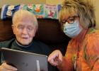 Ruth Anspach with the Cornerstone Activity Center is connecting resident Beulah Richards to be able to talk with her son Dick.