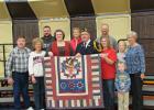 Receiving a Quilt of Valor during the Veteran’s Day program at Win-E-Mac School was Allen Jenson. Allen is pictured here with his family that was in attendance.