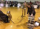 Rilla Nelson of Clearbrook showing how her grandmothers walking wheel worked at the Fiber Festival.