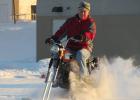 Steve Faldet has some fun out in the snow on the snow-cycle that he and Larry Hedlund put together last winter.