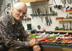 Tom Hemphill, well-known retired Fosston teacher, is shown with a selection of his hand-carved fish decoys.