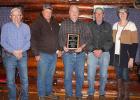 Pine Lake Township members wishing Vernon a good retirement are from left to right: Dennis Bergerson, Paul Buer, Vernon Hamnes, Pete Peterson and Pam Goebel. The plaque reads: Pine Lake Township Treasurer Vernon Hamnes in recognition of Outstanding Dedication and Service from 1984 to 2018.