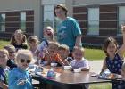 Robin Proffit the school Food Service Director  is pictured with a group of Kindergarteners enjoying the atmosphere.