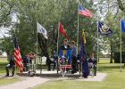 Green trees, blue skies and military branch flags waving provided a peaceful backdrop  for the Memorial Day Service at the Veterans Park in Plummer on May 30. The program was put on by the Plummer Legion Post 623 and the Auxiliary Unit 623. 