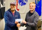 Jeff Ness on the left presents Logan LeClair a check of $500.00