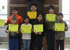 March Elementary Students of the Month. Pictured in front (left to right): Erik Preuss, Cylee Packineau, Mickaylee Garrigan, Logan Knutson. Pictured in back (left to right): Derek Roy, Kevin Sumner, Keenan Smith.