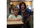 Nancy Edevold- 42 years in the front and Lynette Lene- 48 years holding the flowers.
