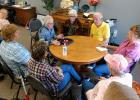  
Playing Farkle at the Senior Connection in Gonvick. Far-left is Donna Carlson, in the circle are Bonnie Swanberg, Charlotte Coyle, Tony Schmitz, Julie Nelson, Sharon Austin, Connie Aubuchon and Marilyn Shamp.  Photo by Carol Reed.
