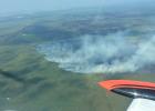 Looking west, you can see Dick’s Parkway and the small ditch perpendicular to it under the wing of the plane. This ditch helped slow the spread, along with immediate and multiple air attack efforts. Photo taken 10:30am Thursday morning, August 23rd. Photo courtesy of MNDNR